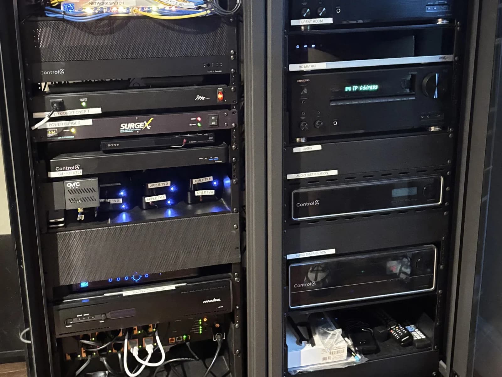 Two equipment racks with labelled networking, structured cabling and Control4 audio distribution